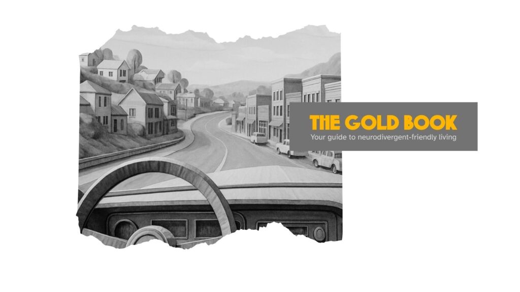 A small town, rendered in cardboard, as seen from the dashboard of a vintage car.